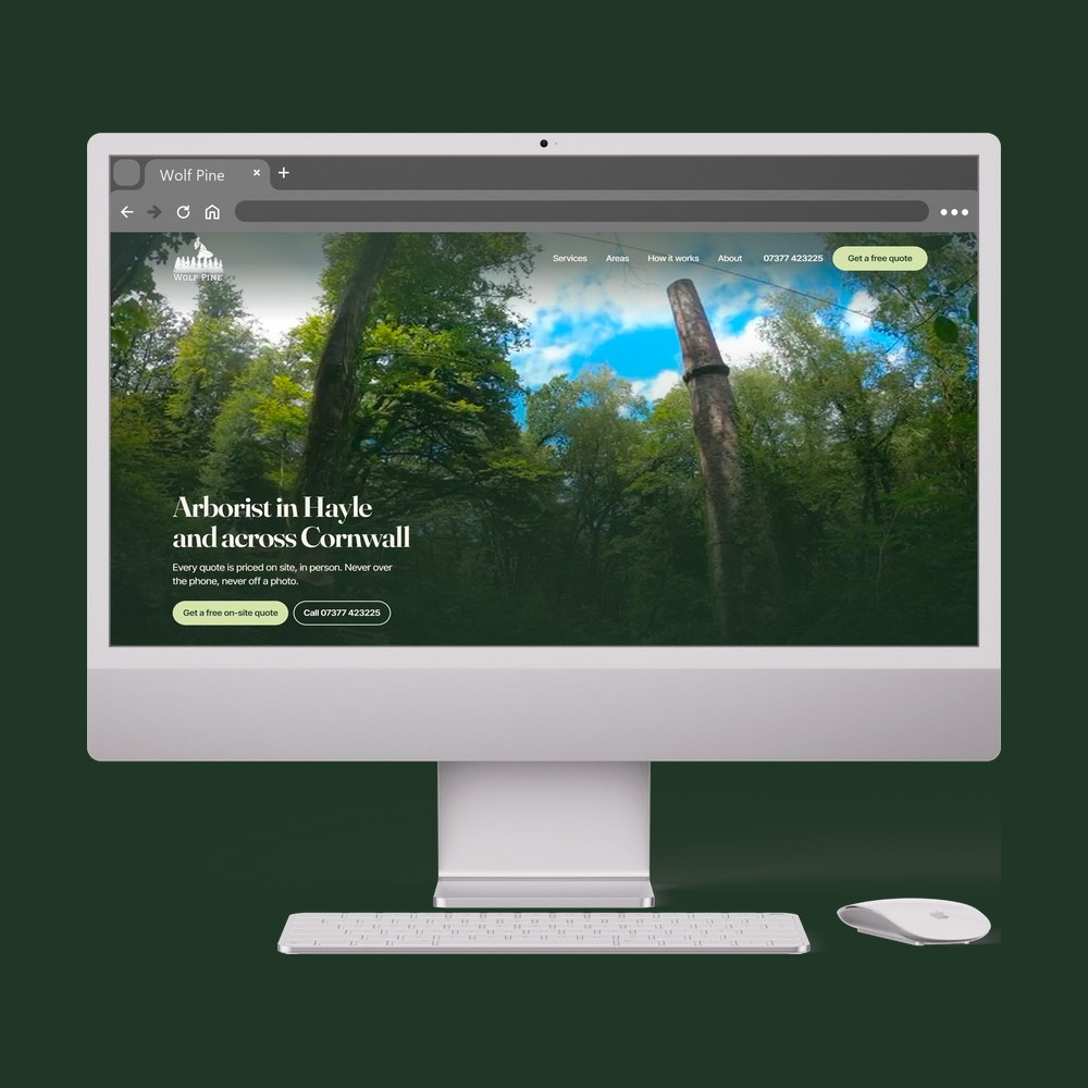The Wolf Pine website shown on a desktop monitor